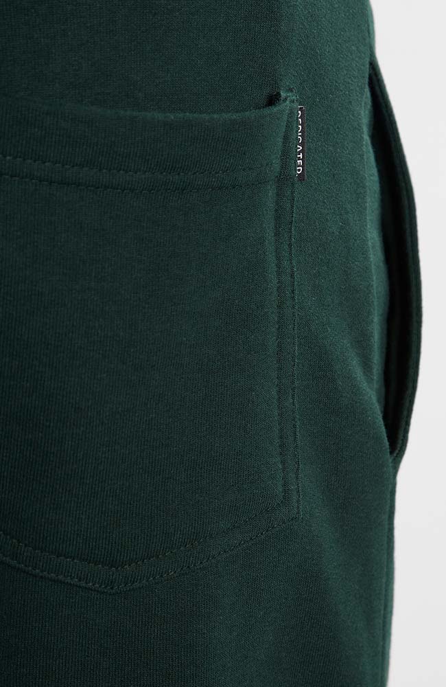 Dedicated Sweatpants lund logo dark green from brushed organic cotton | Sophie Stone